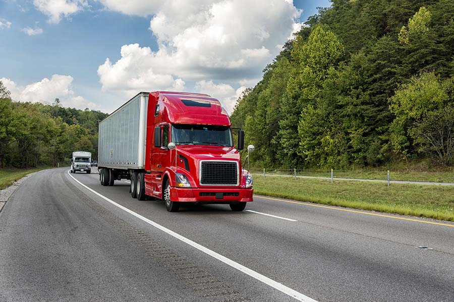 Header - Truck Driving On Highway